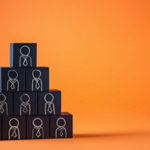 Employees are represented by wooden cubes. Business concept for